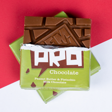 Load image into Gallery viewer, Temprd Chocolate Bar Small - Peanut Butter and Pistachio Milk Chocolate with wrapper peeled back to reveal chunky chocolate.

