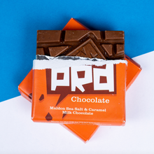 Load image into Gallery viewer, Temprd Chocolate Bar Small - Maldon Sea Salt &amp; Caramel Milk Chocolate with wrapper peeled back to reveal chunky chocolate.
