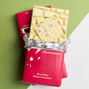 Temprd Chocolate Bar Large - Eton Mess White Chocolate with wrapper peeled back to reveal chunky chocolate.