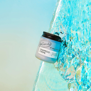 UpCircle Shampoo creme jar on blue water background