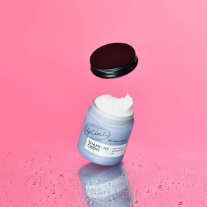 UpCircle Shampoo Creme jar open on pink background